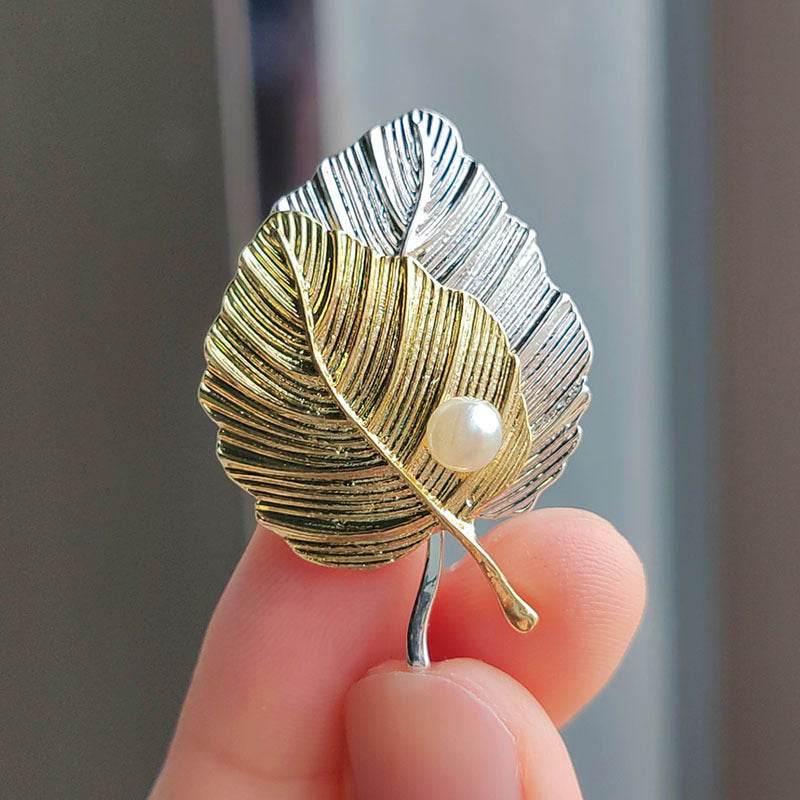 Sparkling Ginkgo Leaf Brooch against neutral background