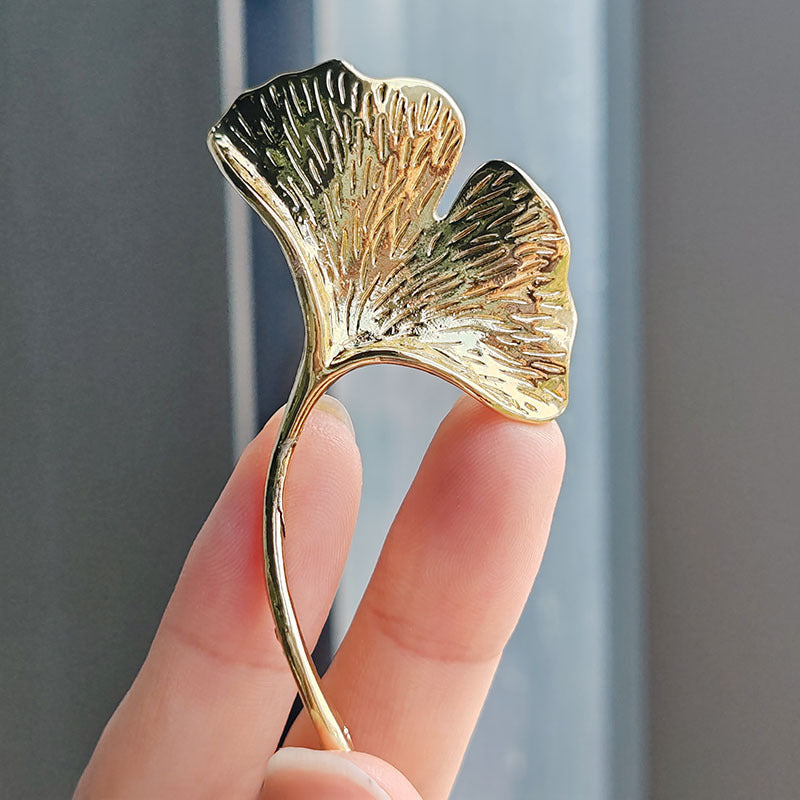 Sparkling Ginkgo Leaf Brooch against neutral background