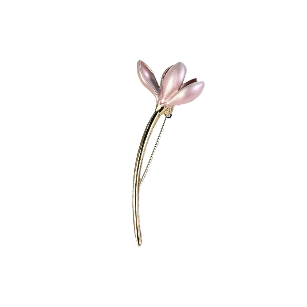 Close-up of floral brooch showcasing design and shine