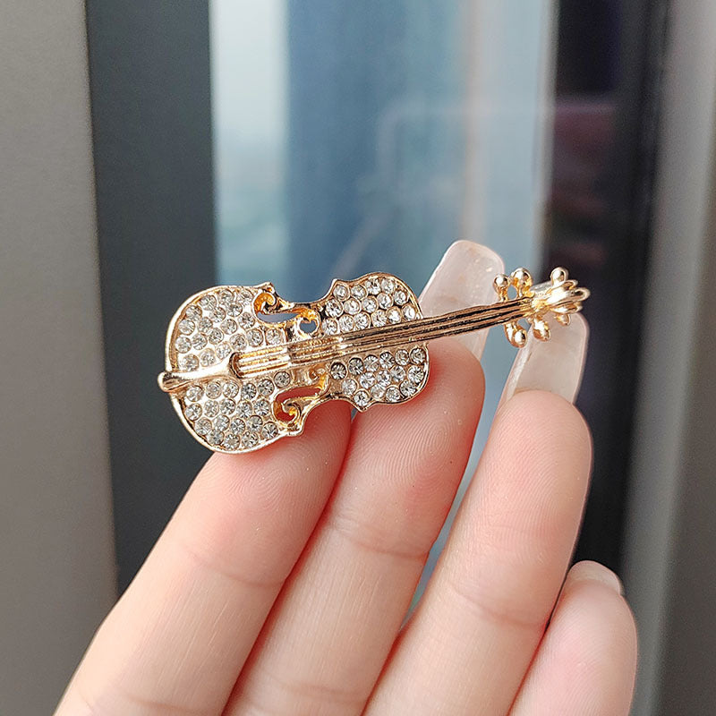 Close up of gold oil drop violin brooch - image 2