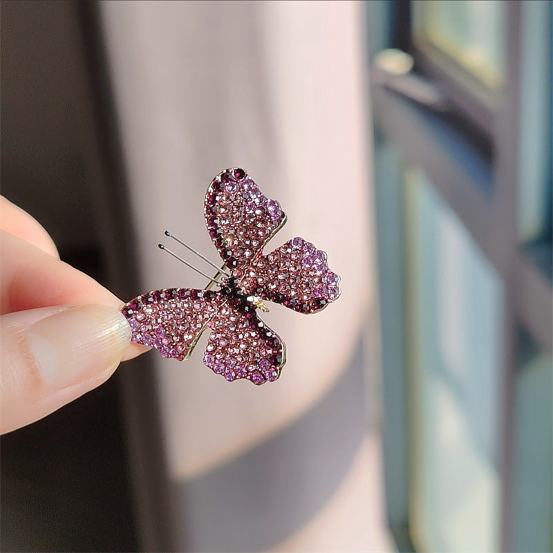 Brooch worn on a coat showing styling options