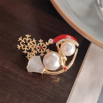 Festive snowman brooch on jacket