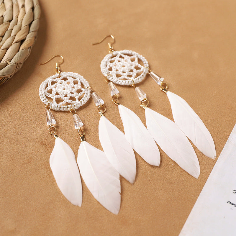 Handcrafted jewelry with feather details