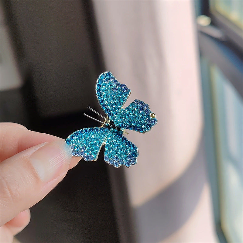 Variations of the butterfly brooch in different colors