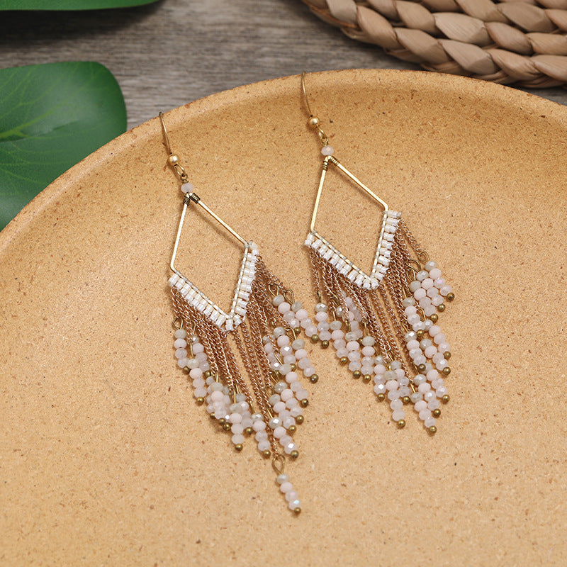 Colorful ethnic earrings displayed elegantly image 4