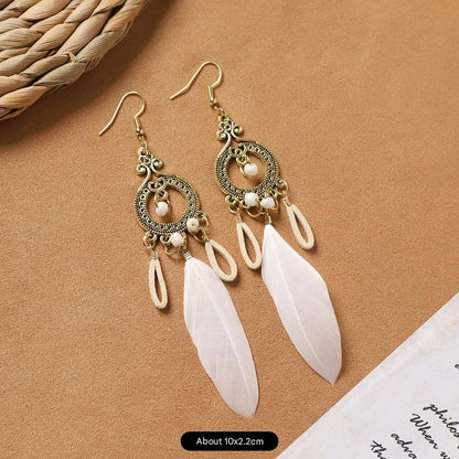 Feather tassel earrings on model