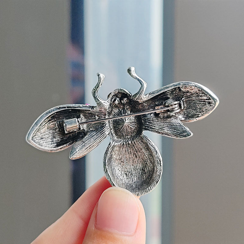 Fashionable woman wearing bee brooch