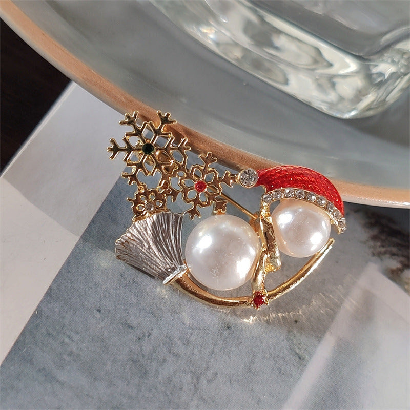 Festive snowman brooch on jacket