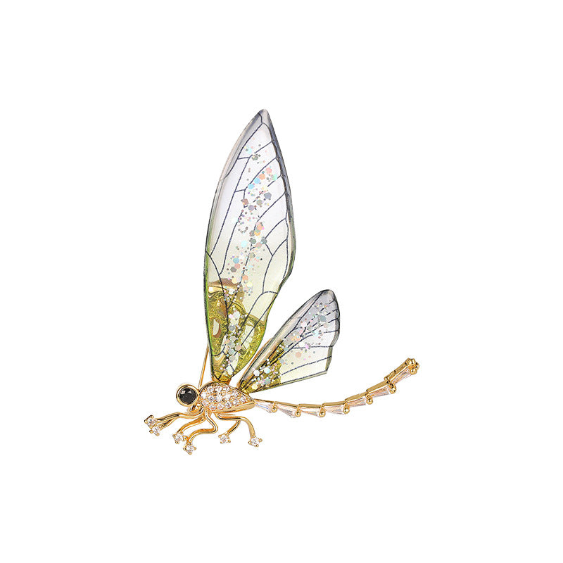 Close-up of colorful dragonfly brooch showcasing detail