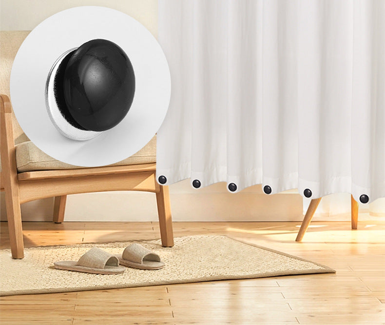 Magnetic curtain weights on a table outdoors