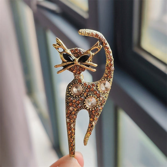 Stylish champagne cat pin with rhinestones