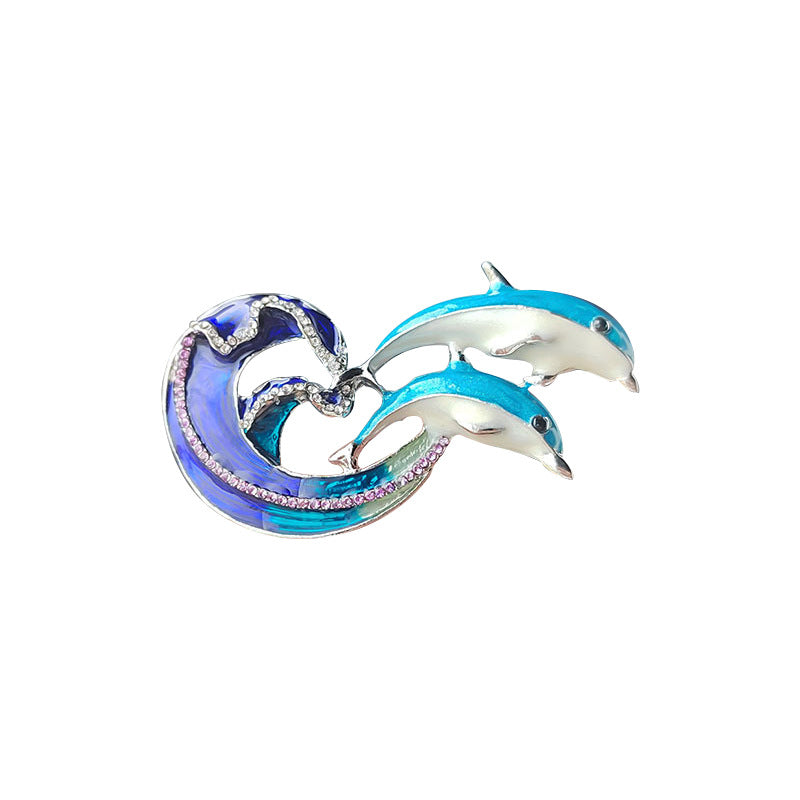 Oil drip finish detail on dolphin brooch