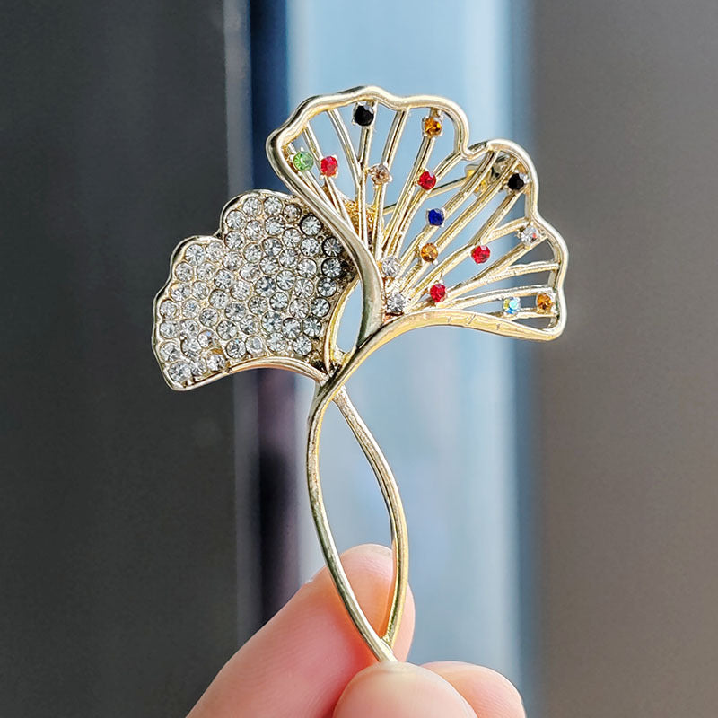 Elegant Ginkgo Leaf Brooch with crystals on a black jacket