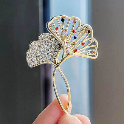 Elegant Ginkgo Leaf Brooch with crystals on a black jacket