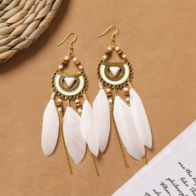 Different style variations of feather earrings