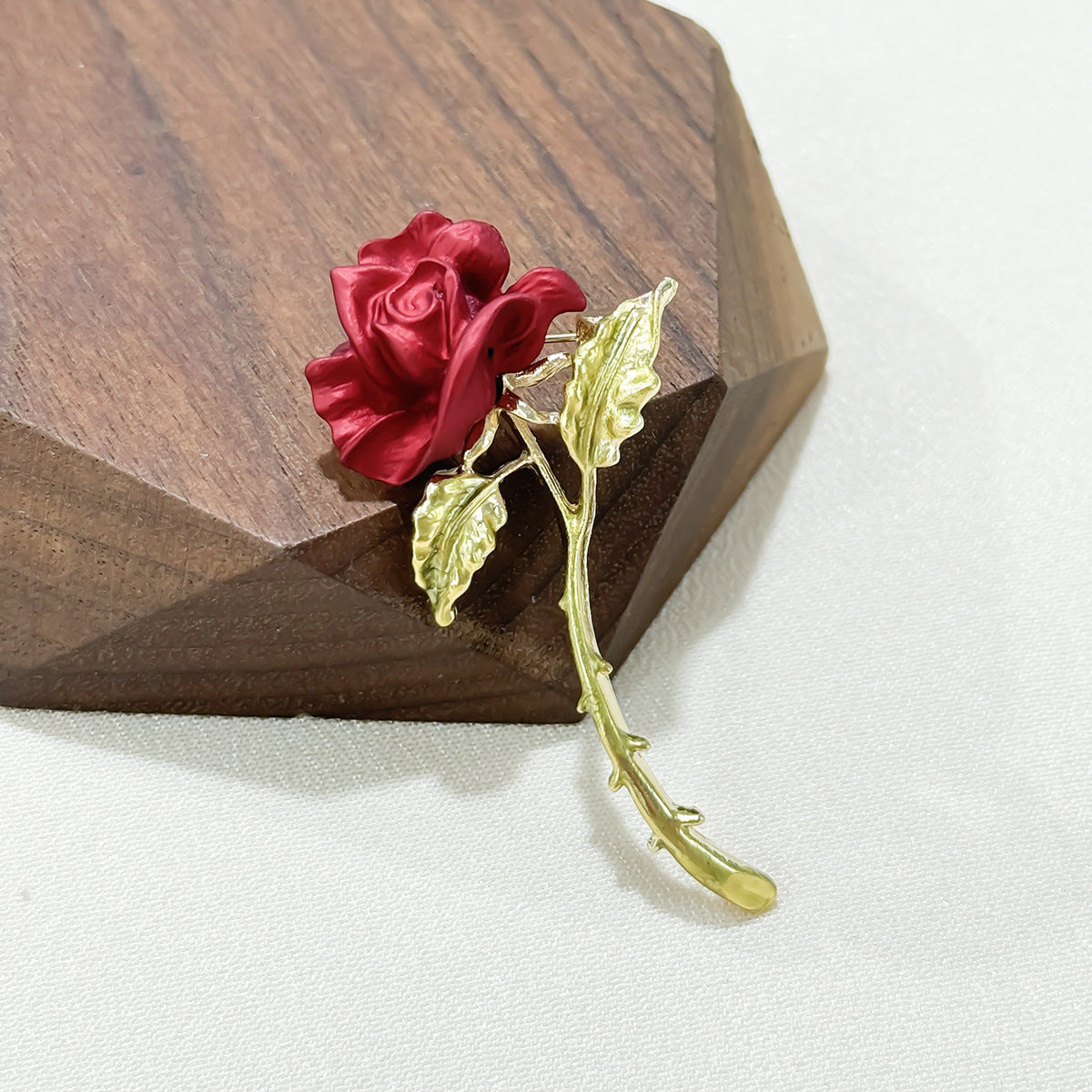 Close-up of Elegant Red Rose Brooch details