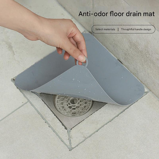 Clog-preventing drain mat