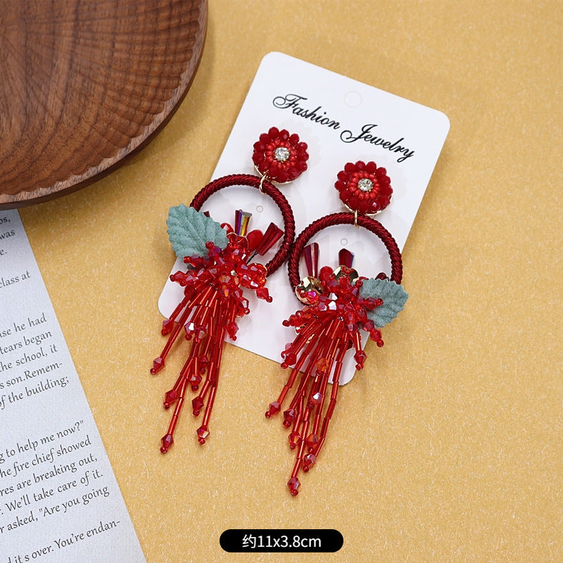 Colorful floral earrings displayed on white background image 3