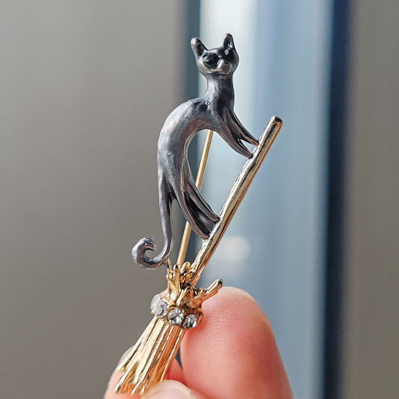 adorable flying broom cat pin