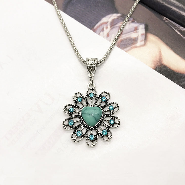 Close-up of turquoise earrings in vintage design - image 2