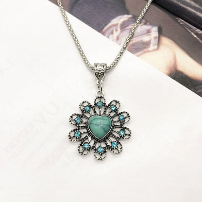 Close-up of turquoise earrings in vintage design - image 2