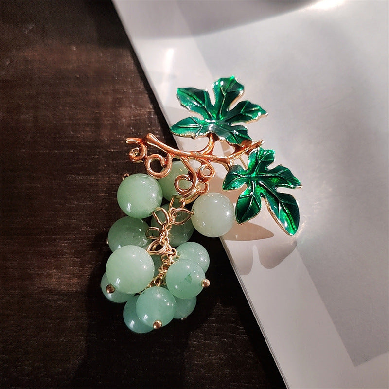 Elegant women's brooch with fruit motifs
