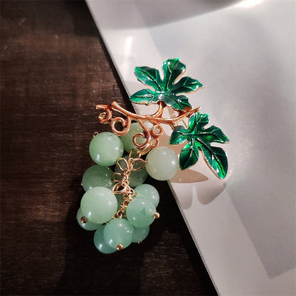 Elegant women's brooch with fruit motifs