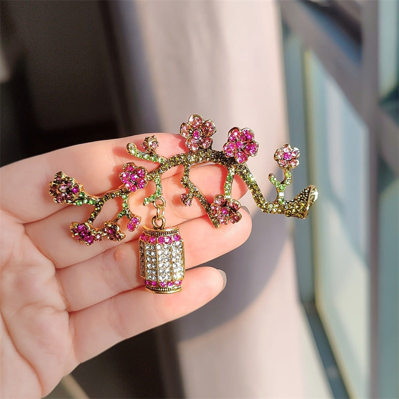 Elegant brooch on fabric background