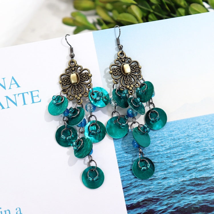 Elegant mother-of-pearl earrings on model