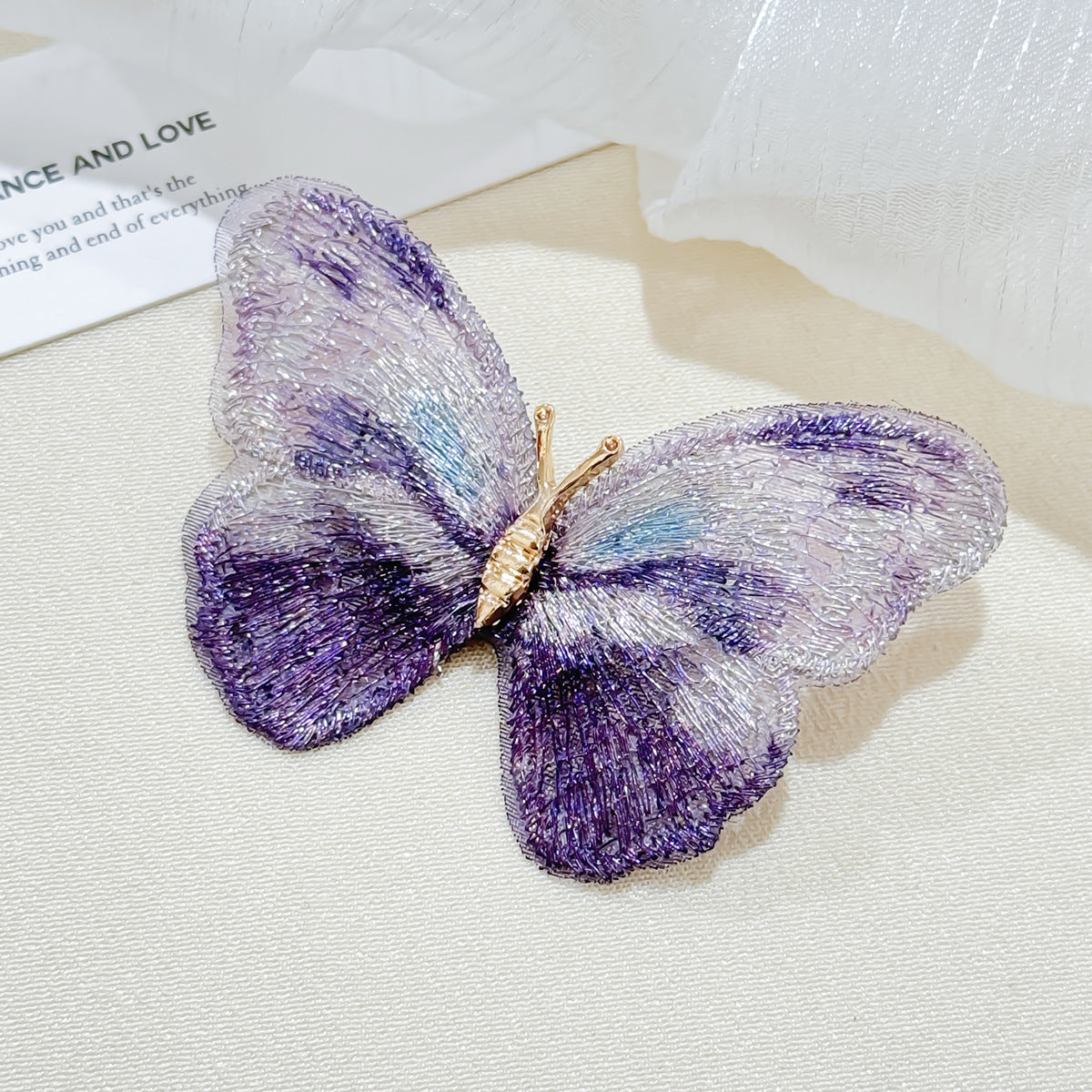Colorful butterfly brooch on display
