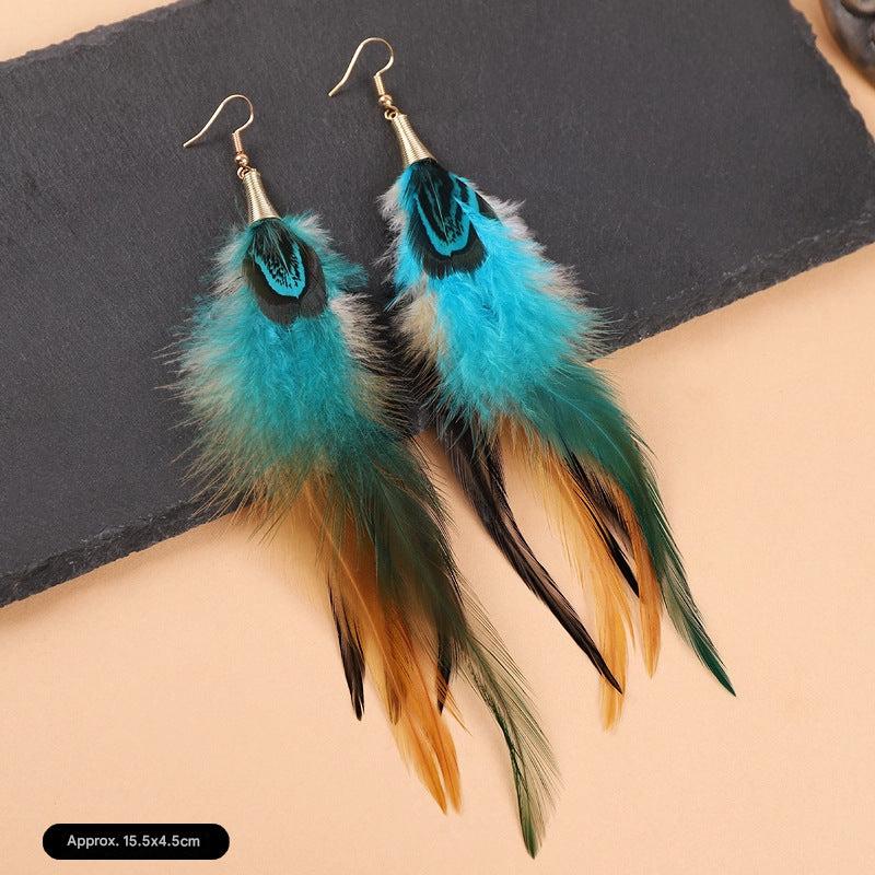 Colorful long feather earrings on a mannequin