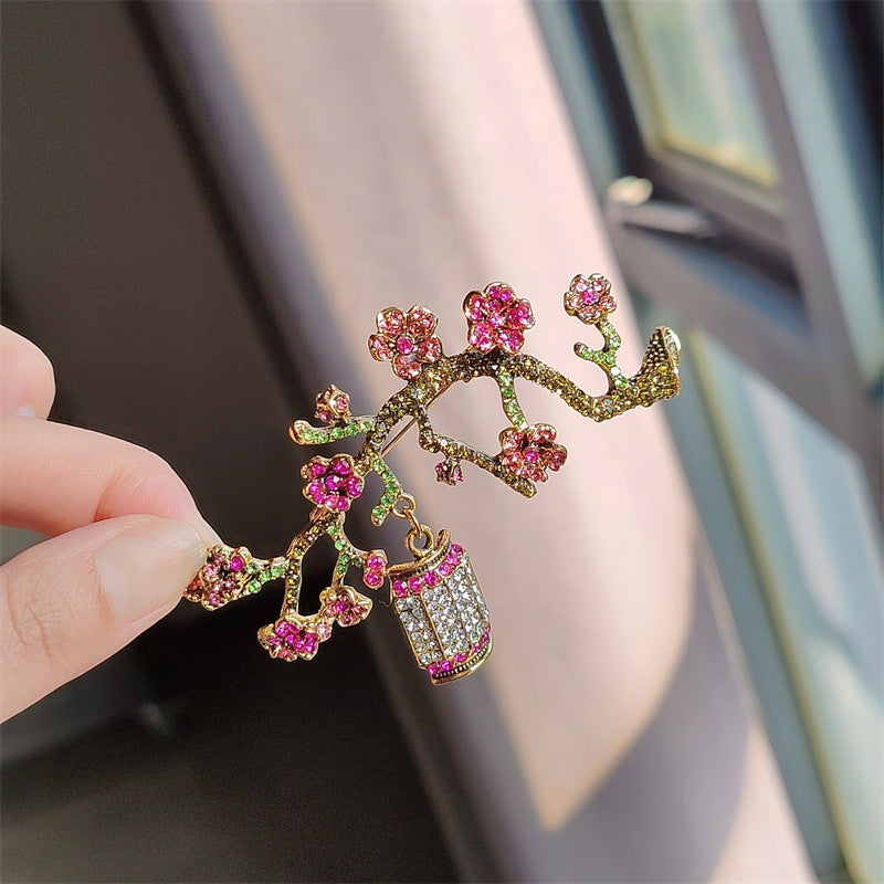 Elegant brooch on fabric background