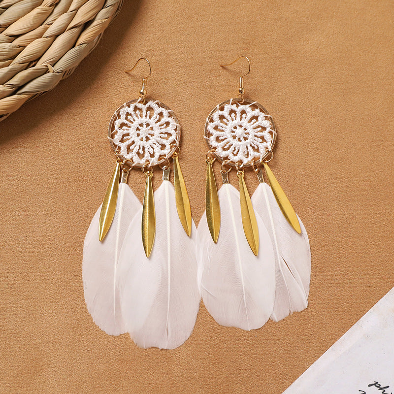 Feather tassel earrings on model