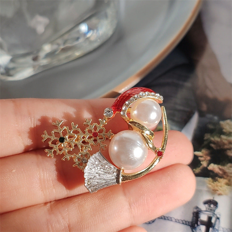 Stylish snowman brooch on sweater