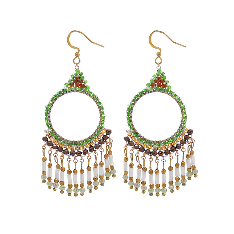 Elegant tassel earrings against a sunny background