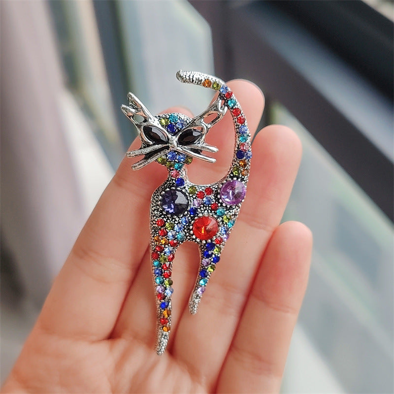 Stylish champagne cat pin with rhinestones