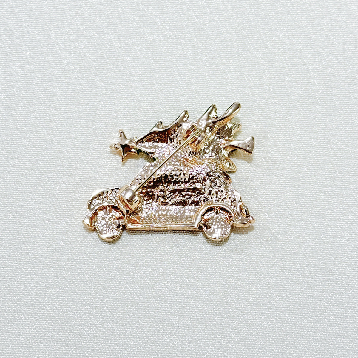 Beautifully designed Christmas Brooch with car and tree